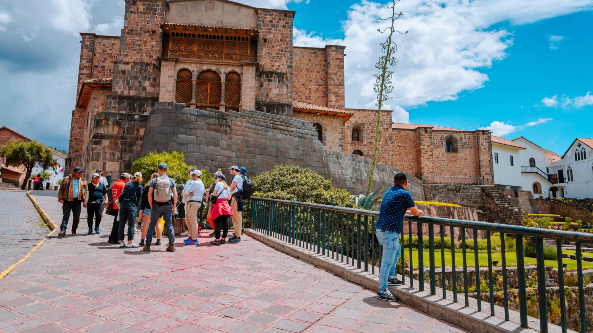 Visitors exploring an archaeological site in Cusco city, Peru